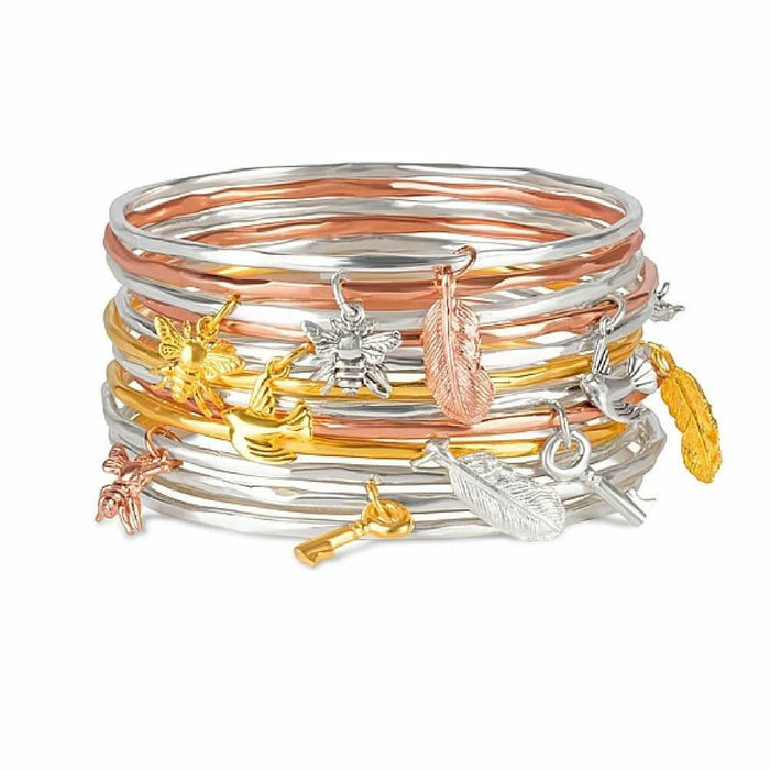 stack of bee bangles on a white background