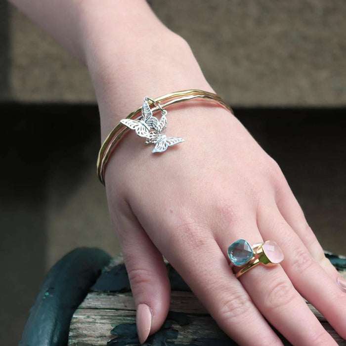 model wearing butterfly bangle on her wrist