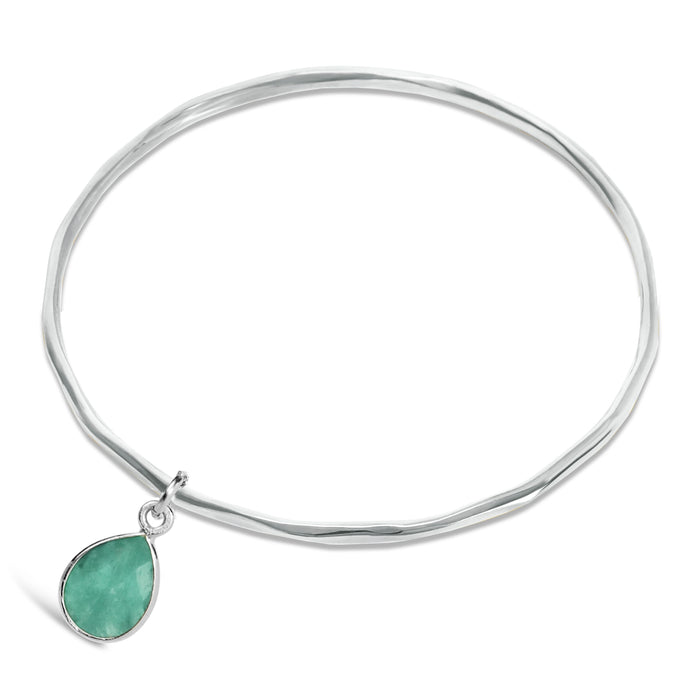 Chrysoprase gemstone silver bangle on a white background