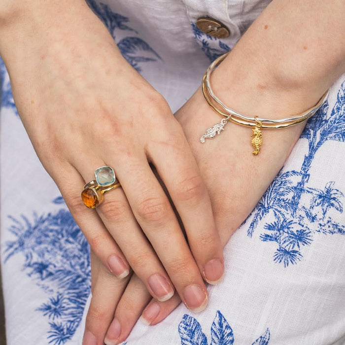 model wearing citirne cocktail ring in gold