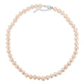 classic pearl necklace in champagne on a white background