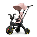 A blush pink Liki Trike S1 with a parent control bar and high & low backrest, designed for toddlers.