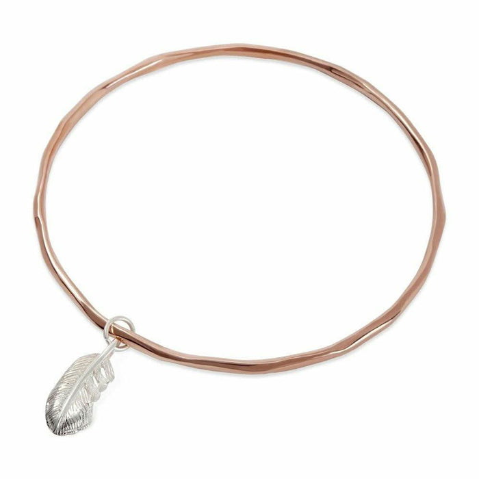 rose gold bangle with silver feather charm attached