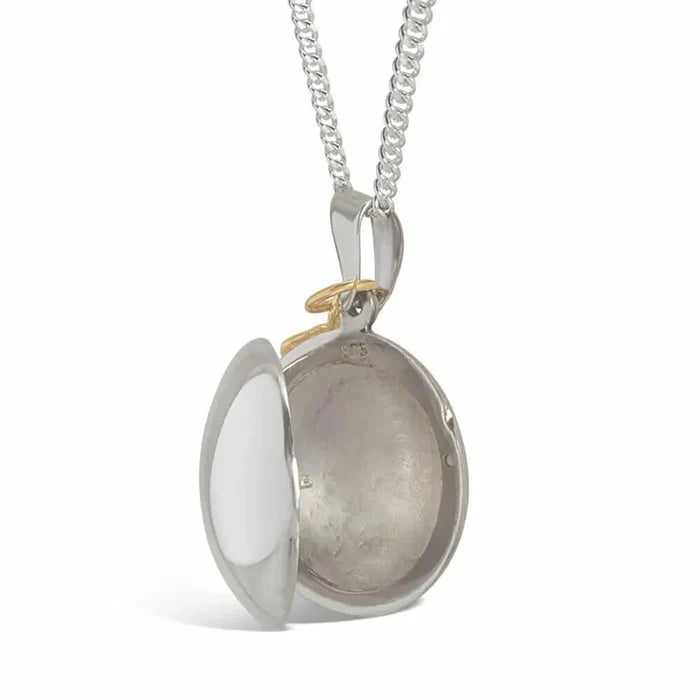 Sterling silver photo locket with gold feather charm, personalised with two images inside, meaningful memory jewellery