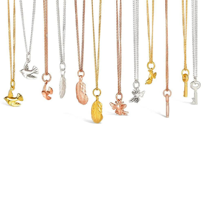 collection of charm pendants with different charms attached