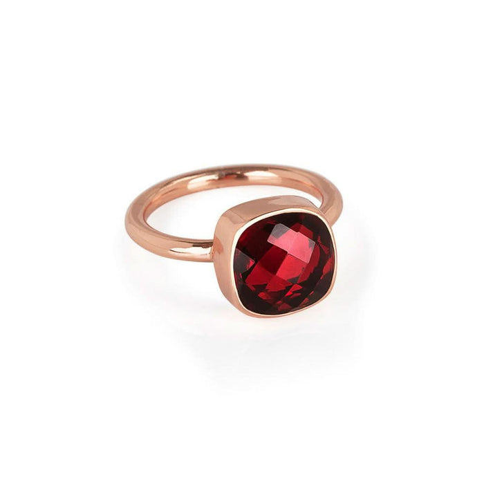 garnet cocktail ring in rose gold on a white background