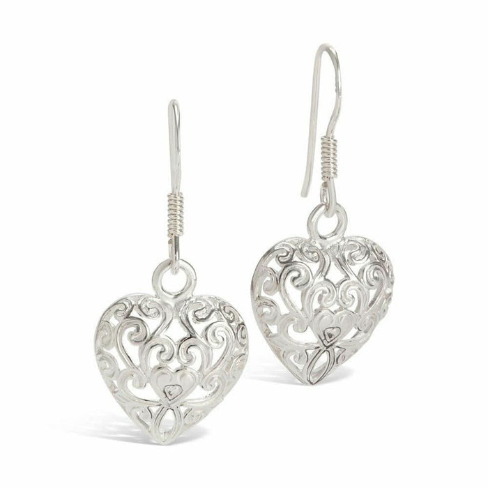 silver heart earrings on a white background