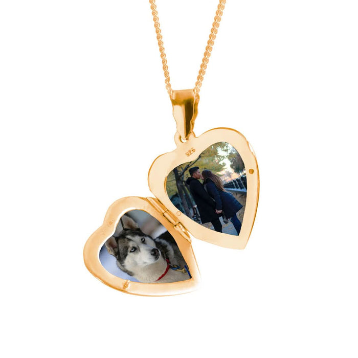 opened heart locket necklace in gold on a white background