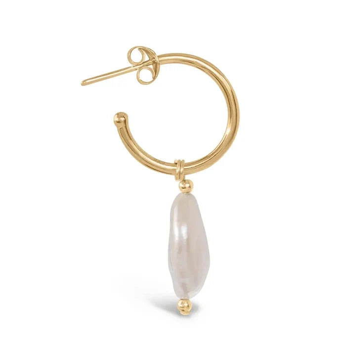 Close-up side view of gold hoop earring with elongated coin pearl drop detail