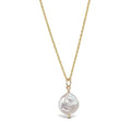 Gold rope chain necklace with coin pearl pendant on white background, minimalist freshwater pearl design