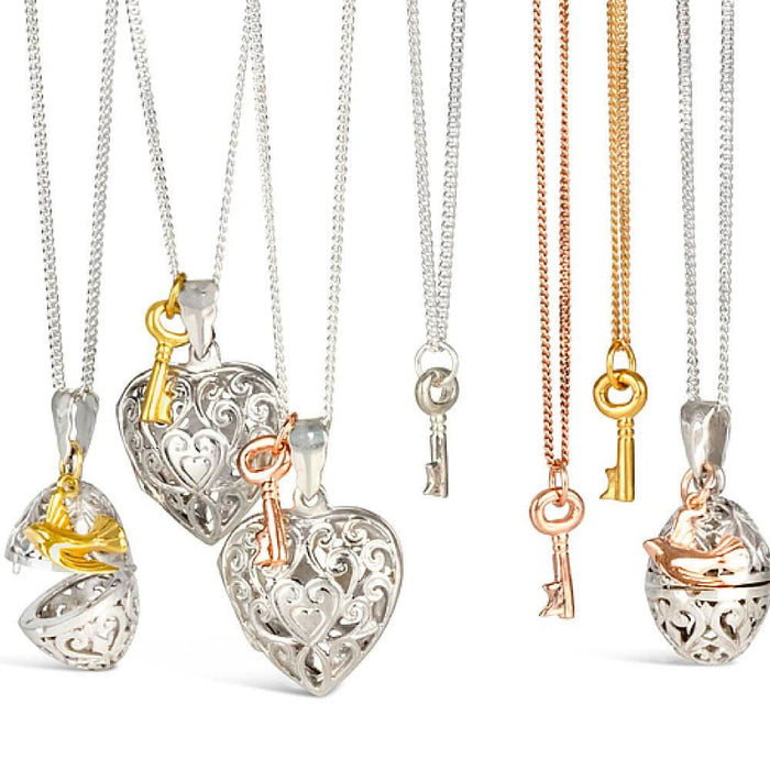 collection of jewellery with key and bird charms