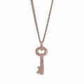 key pendant in rose gold on a white background
