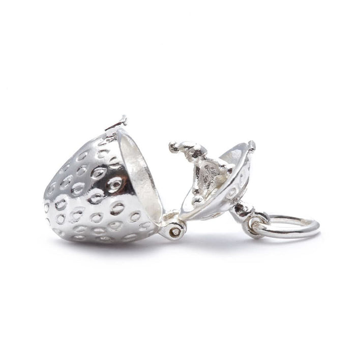 opened magical strawberry charm on a white background
