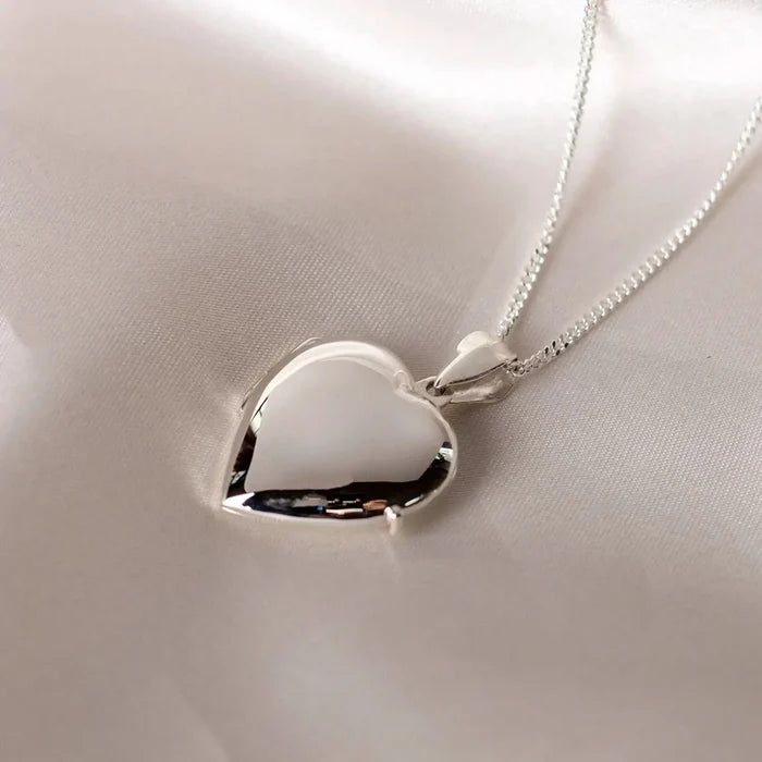 Silver heart Necklace for ashes, memorial necklace, locket with one photo and ashes storage, silver curb chain, engraving, silk sheet background