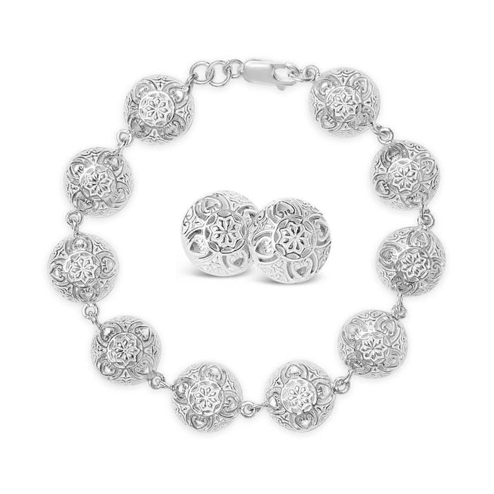 memory keeper earrings and bracelet on a white background