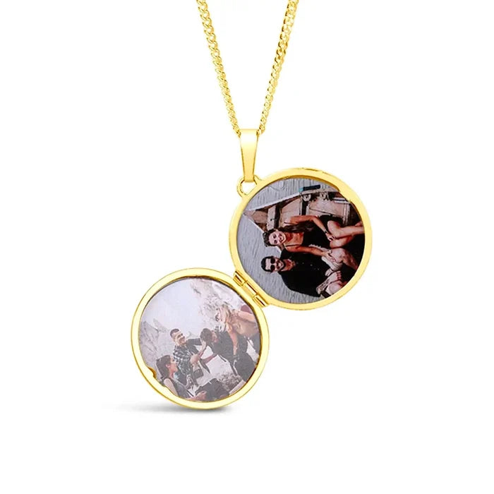 Gold round locket necklace open to display two personal photos inside, polished gold vermeil finish