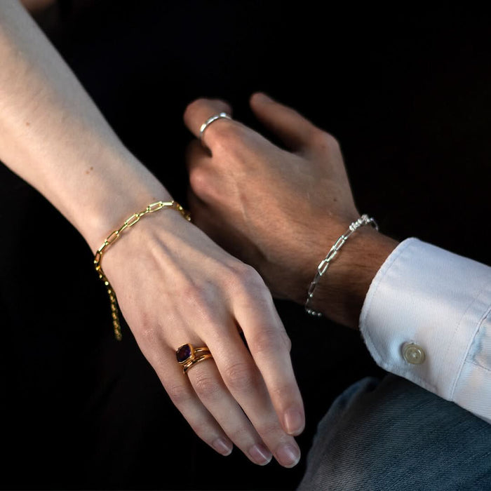 models wearing paperclip chain bracelet in silver and gold