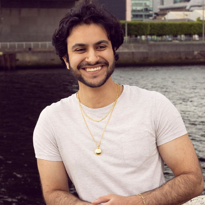 model wearing men's round locket necklace