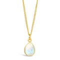 moonstone charm necklace in gold on a white background