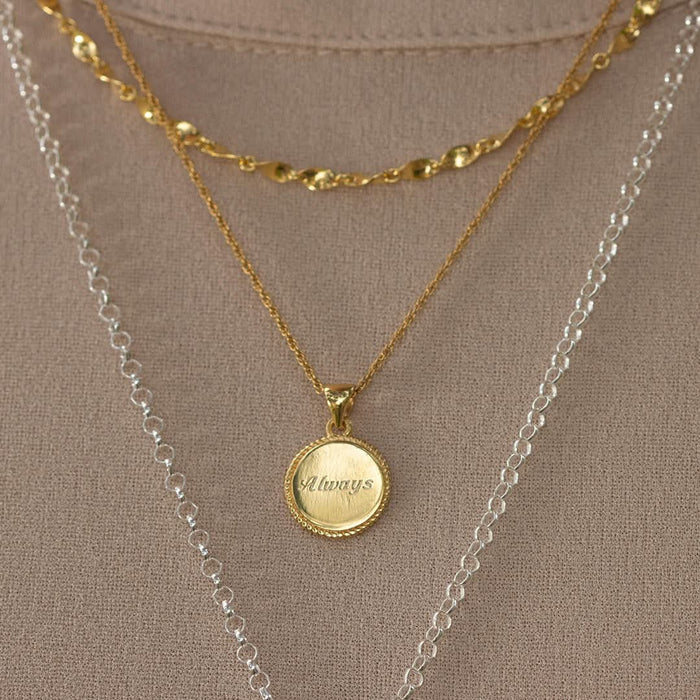 model wearing gold rope chain with engravable disc