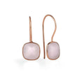 rose quartz earrings in rose gold on a white background