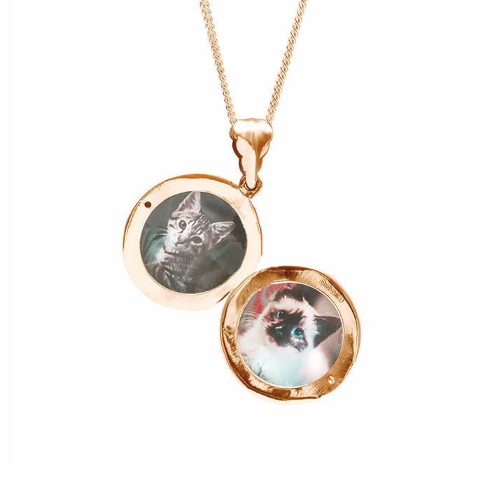 round locket necklace in rose gold on a white background