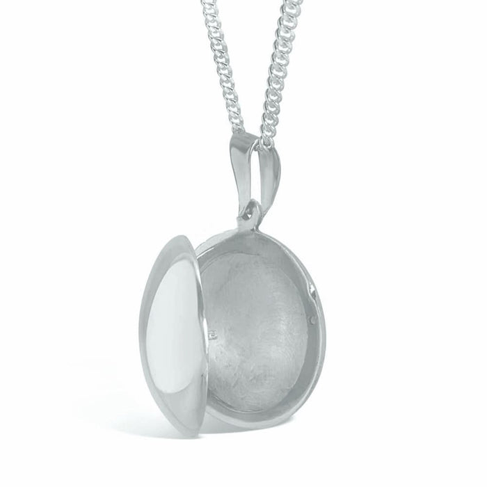 round locket necklace in silver on a white background