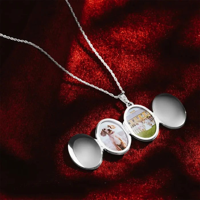 Sterling silver six-photo oval locket necklace open on a red velvet background, showing personalised family and pet photos inside, suspended on a silver chain.