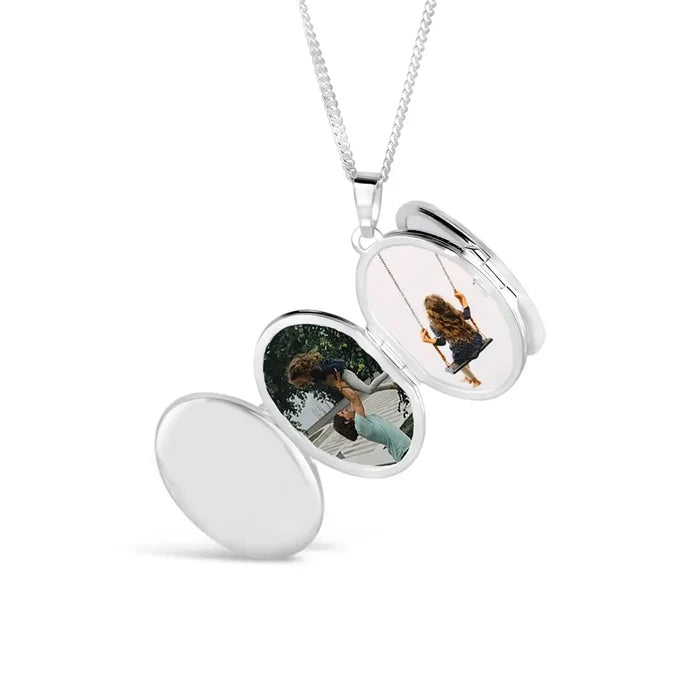 Sterling silver oval locket necklace open to display personalised family photographs inside, high-polish finish with removable photo frames on a silver chain.