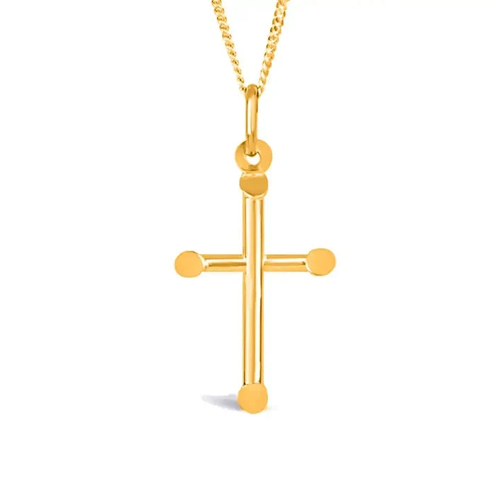 Solid gold cross pendant necklace with polished finish and rounded edges on fine chain, white background