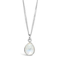 white quartz charm necklace in silver on a white background